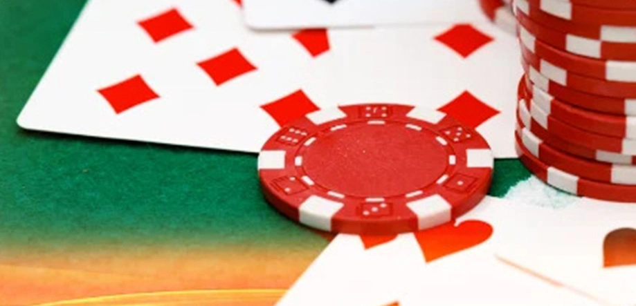 blackjack cards and chips on a table
